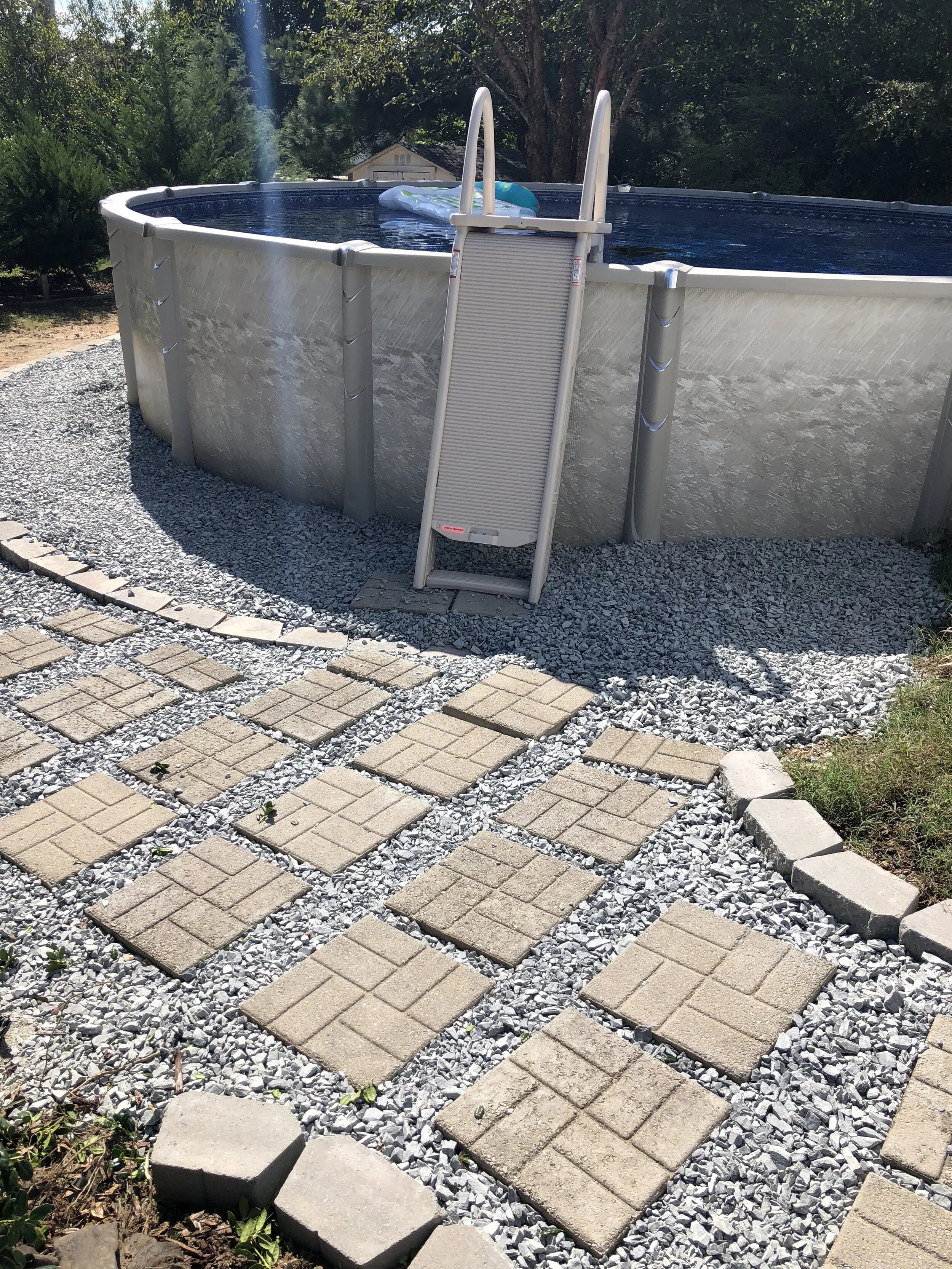 Hybrid Oasis above-ground pool, partially recessed
